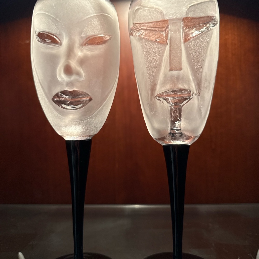 Artistic Frosted Glass Face Sculptures with Black Stands